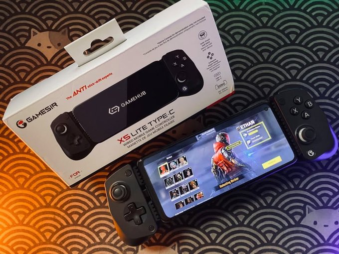A GameSir X5 Lite Type-C wireless mobile game controller displayed alongside its packaging, attached to a phone showing the game character selection screen.