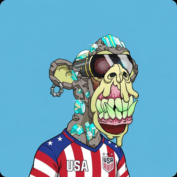 The image features a cartoon monkey wearing a red, white, and blue shirt with "USA" written across the front. The monkey appears to be holding an object that resembles a gun or a shield, which could be interpreted as a symbol of power or protection. The background is a solid blue color, providing a stark contrast to the colorful attire of the monkey. The image also includes text that reads "Buy an ape Hold an ape Be your ape Be proud to be a part of this community BAYC".