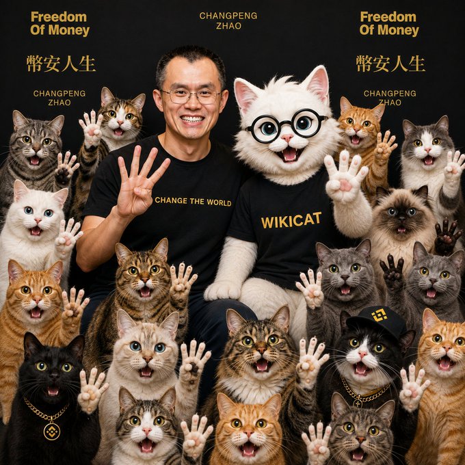 A man and a white cat wearing glasses sit surrounded by many cats, wearing shirts that say 'CHANGE THE WORLD' and 'WIKICAT', with text reading 'Freedom Of Money', 'CHANGPENG ZHAO', and '幣安人生'.