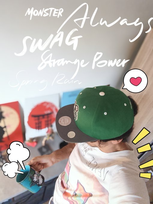 A person wearing a green baseball cap backward holding a teal mug, with stylized white text overlays reading 'MONSTER, Always, SWAG, Strange Power, Spring Rain' and cartoon graphic accents.