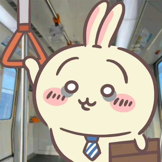 A cute cartoon rabbit character with a blue striped tie holding onto an orange subway strap, smiling with rosy cheeks inside a train car.
