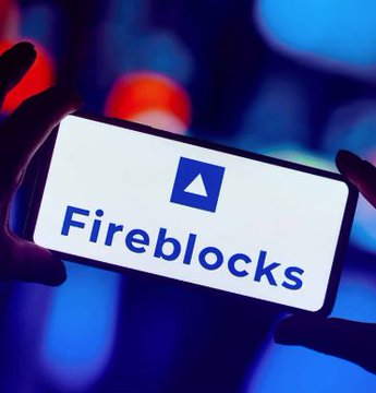 A silhouetted hand holds a bright smartphone screen showing the “Firebase” logo and name against a blurred blue-and-red background.