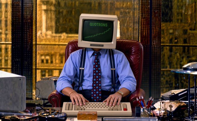 A businessman with a CRT monitor for a head sits at his desk, the screen displaying "QUOTRONS" alongside an upward-trending stock chart. The satirical image humorously suggests that the man is so consumed by the constant rise of the market that he doesn't realize—unlike the viewer—that reality may not be as bullish as it appears.