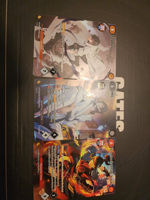 The image shows three cards, each with a different design or illustration, placed together on top of a table. The cards are slightly overlapping one another, creating an interesting visual effect. The text "focus on what is in the image" suggests that the viewer should pay attention to the details and composition of these cards rather than just focusing on their overall appearance.