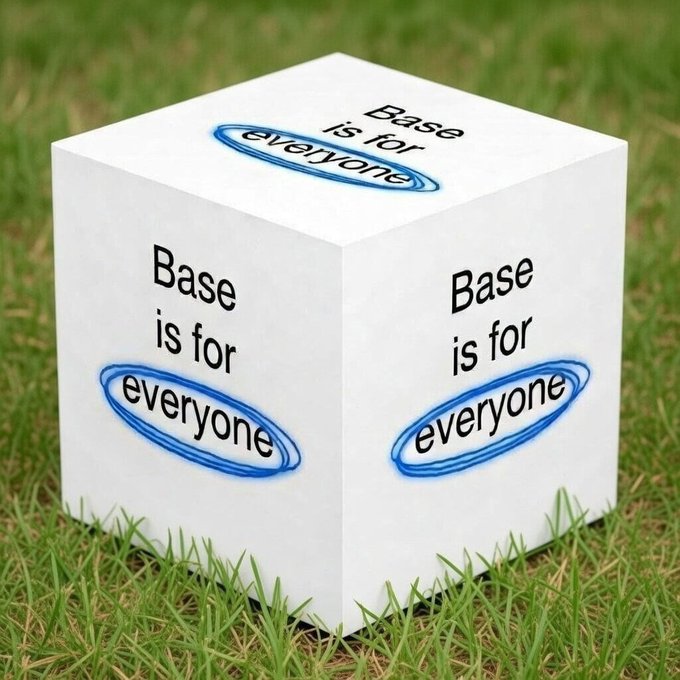 A white cube sitting on grass with the phrase 'Base is for everyone' printed on its visible sides, with the word 'everyone' circled in blue on each face.