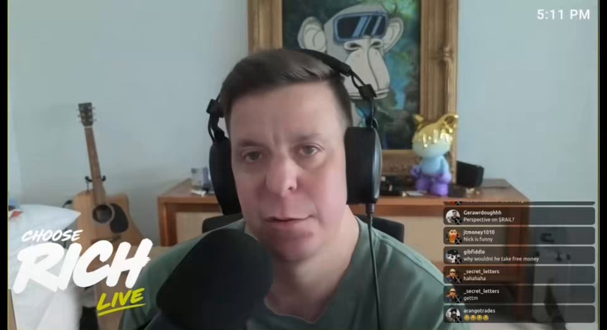 The image shows a man wearing headphones, sitting at a desk with a microphone in front of him. He appears to be engaged in a video call or live streaming session. The background features a painting of a monkey, which adds an artistic touch to the scene. The caption on the image reads "Choose Rich Live", indicating that this is likely related to a content creator discussing trading strategies and experiences with their audience.