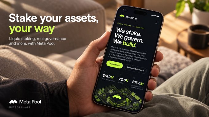 Advertisement for Meta Pool with text 'Stake your assets, your way' featuring a phone displaying the Meta Pool app interface on a couch.