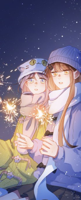 An anime-style illustration of two girls in winter clothing and beanies holding sparklers against a starry night sky.