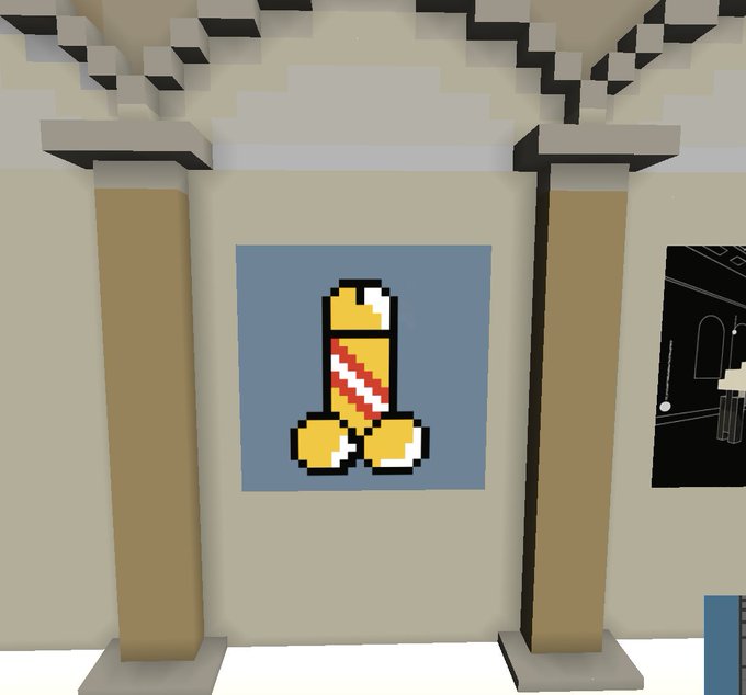 A pixel art image showing a yellow item with a red and white diagonal stripe, resembling a sword or shield emblem, displayed on a blue square between two pillars.