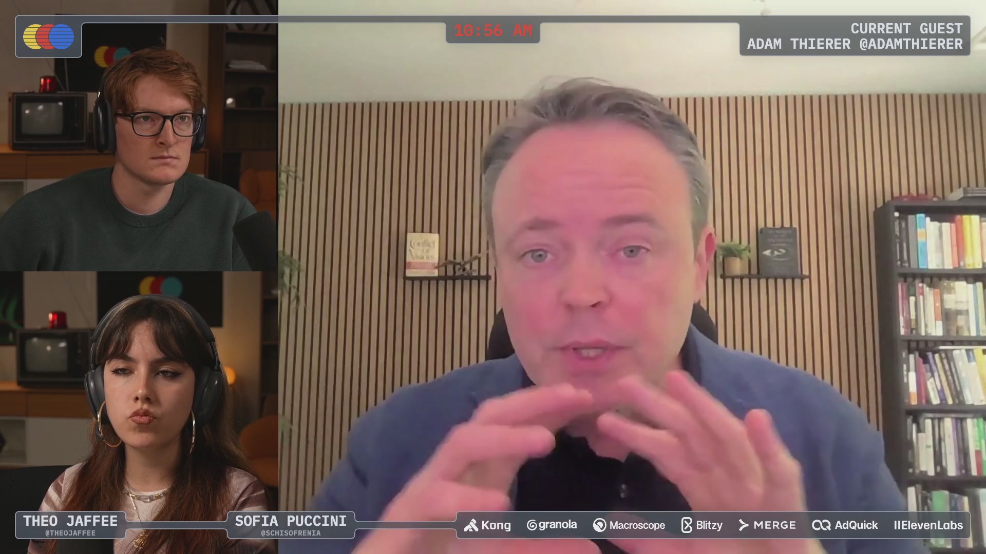 The image shows a computer screen displaying three people sitting behind a desk, with one person speaking into a microphone. The background features a bookshelf filled with various books. The caption of the image reads "@MTSlive Will be jumping on @MTSlive in 90 minutes talking all things @solanamobile".