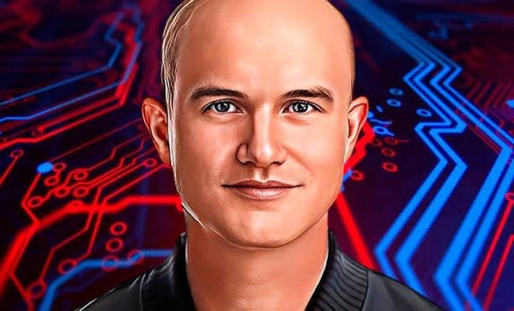 A digital illustration/portrait of a bald man with a slight smile against a blue and red circuit board patterned background.