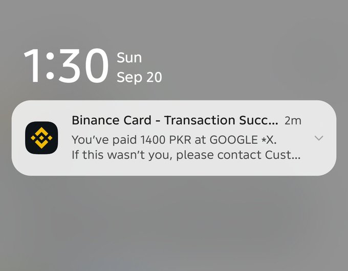 A phone lock screen showing the time 1:30 on Sunday, Sep 20, with a notification from Binance Card confirming a successful transaction of 1400 PKR at GOOGLE *X.