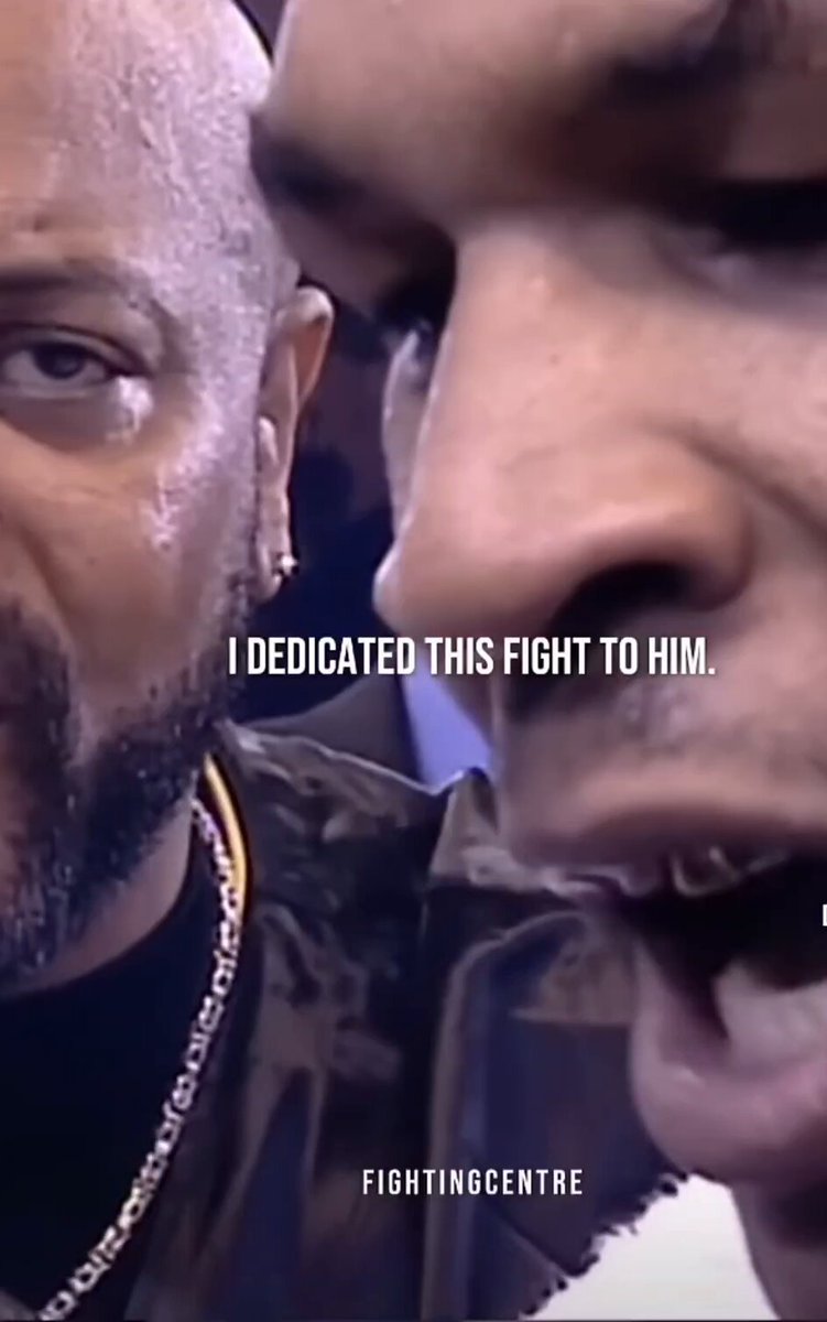 The image features a man with a beard wearing a leather jacket, who appears to be balding or has a shaved head. The caption below his face reads "I dedicated this fight to him." This statement suggests that the man is dedicating his efforts in a fighting match to another fighter, possibly as a gesture of support or motivation.