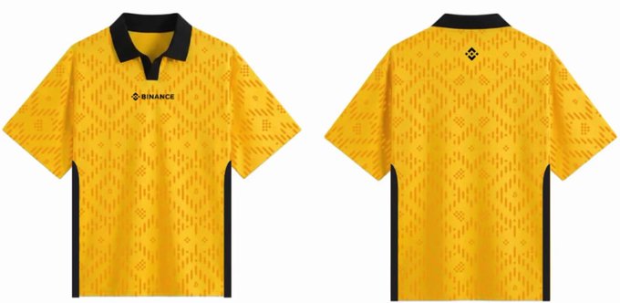 The image features a yellow polo shirt with black accents displayed both front and back views. The text "Draw for #Binance World Cup Limited Edition Jersey" can be seen, indicating that this is likely an advertisement or promotional material related to the World Cup. The post also mentions that it was created by @binancezh and @wukong2021, suggesting that these individuals may have contributed to the design of the image.