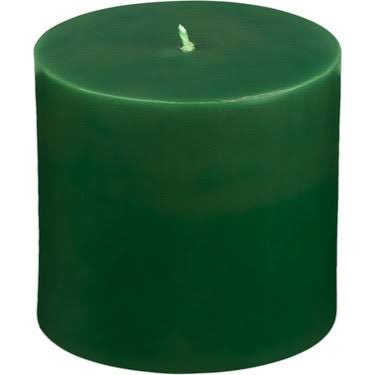 A thick, solid green pillar candle with a single wick in the center. The image perfectly illustrates the post's affection for candles "from the thickest to the biggest," showcasing a notably wide and chunky pillar design.