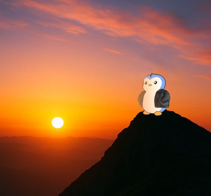 A small animated penguin character wearing a gray backpack perches atop a silhouetted mountain peak against a vivid orange and pink sunset sky with the sun low on the horizon.