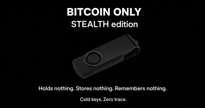 A black promotional image featuring a USB drive in the center with the text 'BITCOIN ONLY STEALTH edition' and the tagline 'Holds nothing. Stores nothing. Remembers nothing. Cold keys. Zero trace.'