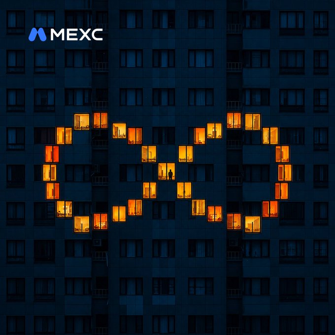A MEXC cryptocurrency exchange advertisement showing a dark blue apartment building at night with illuminated windows forming the MEXC logo.