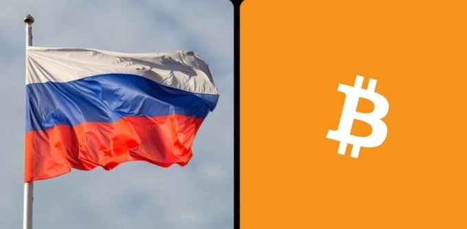 The Russian flag waves beside the Bitcoin symbol on an orange background, visually representing Russia's entry into regulated crypto trading—where Sberbank projects ~$46.4 billion in first-year volume under new rules taking effect September 1.