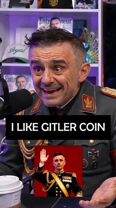 A man in a military uniform with a wide-eyed expression speaks into a microphone, with the text "I LIKE GITLER COIN" overlaid on the screen, while an inset image below shows a man in uniform saluting.