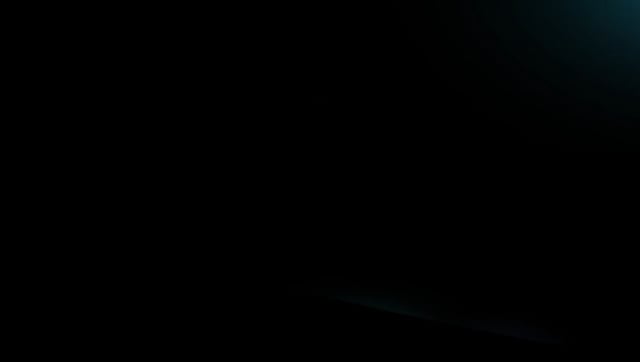 A nearly entirely black image with very subtle dark tones, appearing to show no discernible content or subject.
