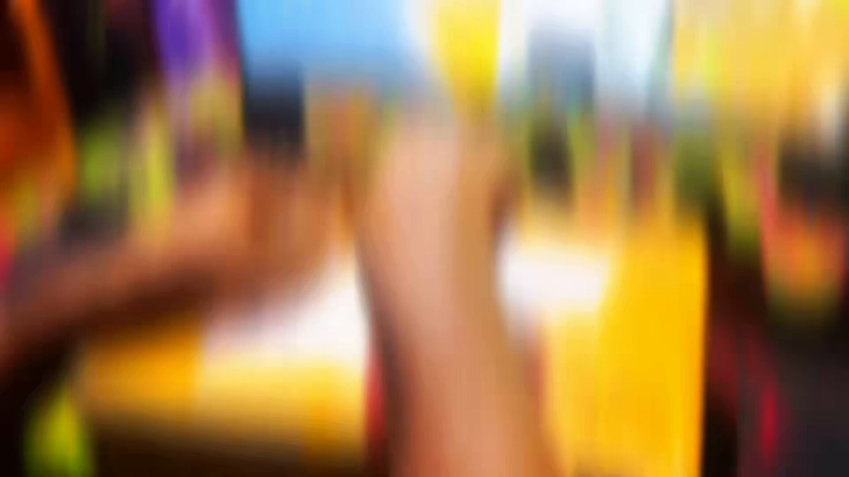 The image features a blurred photo of someone's hand holding an object, possibly a pen or pencil, with their thumb visible. The background appears blurry, suggesting that the focus was on capturing the person's hand rather than the surrounding environment. The image is related to the Binance Moments series and is accompanied by a caption that reads: "Unboxing A Surprise Gift From Binance Moments like this make the Web3 journey even more memorable Truly grateful for the love & recognition Huge thanks to @0xclover233 & @binance this wonderful gift".