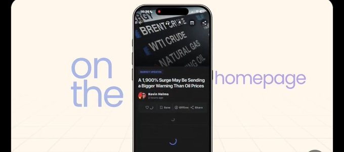 A smartphone displays a Market Updates article titled 'A 1,900% Surge May Be Sending a Bigger Warning Than Oil Prices' by Kevin Helms, overlaid on background text reading 'on the' and 'homepage.'