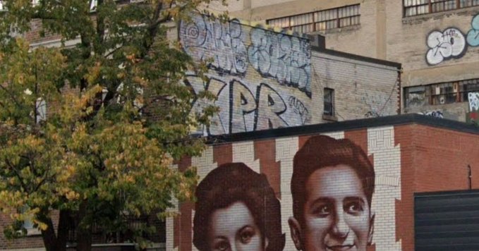The image features a mural painted on a brick building, depicting two people's faces with graffitied expressions. The mural is located next to a tree, adding an artistic touch to the urban landscape. Below the mural, there are graffiti tags that read "neighbourhood art i was meant to discover letting me know it". The image also includes text that reads "dive into the world of art" and "let me know what you think".