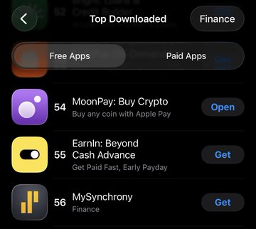 The image shows the "Top Downloaded" Free Apps list in the Finance category, featuring MoonPay: Buy Crypto at #54, Earnin: Beyond Cash Advance at #55, and MySynchrony at #56. This relates to the post celebrating two finance apps reaching the top 100, with MoonPay visible on the chart as a competitor to the user's PayBox app.