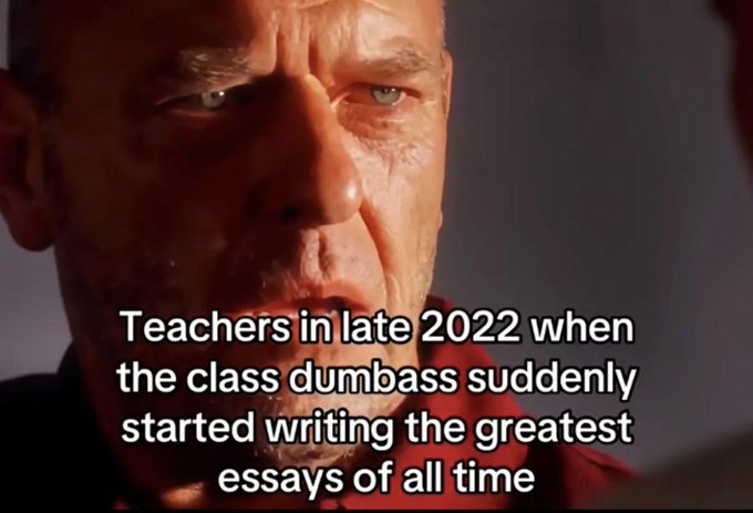 A close-up of actor John Goodman's character looking intently off-camera, with overlaid white text reading: "Teachers in late 2022 when the class dumbass suddenly started writing the greatest essays of all time."