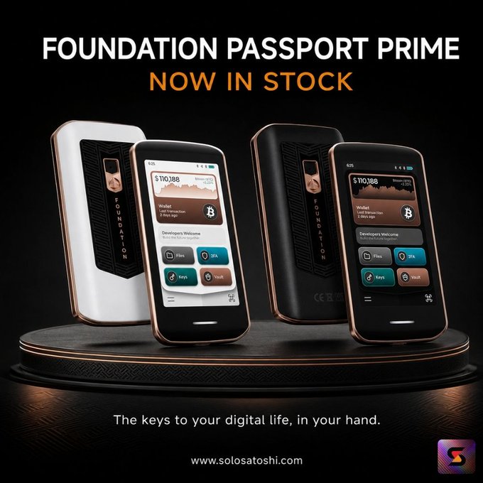 A promotional advertisement for "FOUNDATION PASSPORT PRIME - NOW IN STOCK," displaying two hardware wallet devices (white and black) on a pedestal with the tagline "The keys to your digital life, in your hand" and website "www.solosatoshi.com."