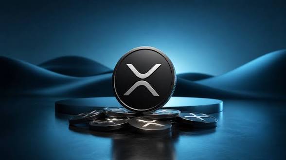 The image features a coin with an "X" symbol on it, which represents Ripple cryptocurrency. The coin has been placed on top of several other coins, creating a pile or stack. The background of the image is blue, giving it a futuristic appearance. The text in the image reads "XRP liquidity on Binance has dropped to its lowest point since January 202o. As order book depth continues to shrink and market sentiment weakens, XRP is trading around $1.34, down 3.5% over the last 7 days". This information suggests that the value of Ripple cryptocurrency may be affected by the current state of the cryptocurrency market.