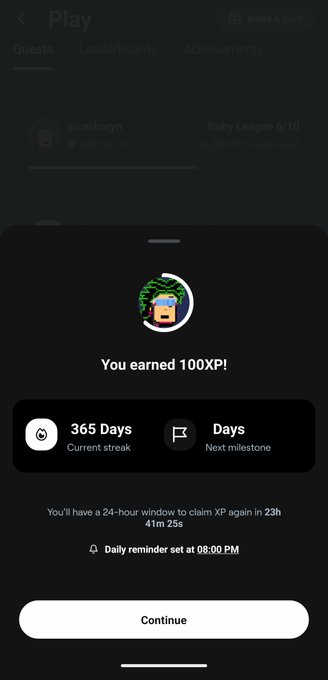 A mobile app screen congratulating the user 'You earned 100XP!' showing a 365-day current streak for @carlkoryn in the Ruby League, with a 24-hour window to claim XP again in 23h 41m 25s.