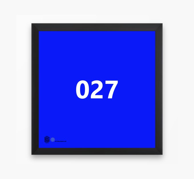 A blue framed art print or poster displaying the number '027' in white text against a solid blue background.