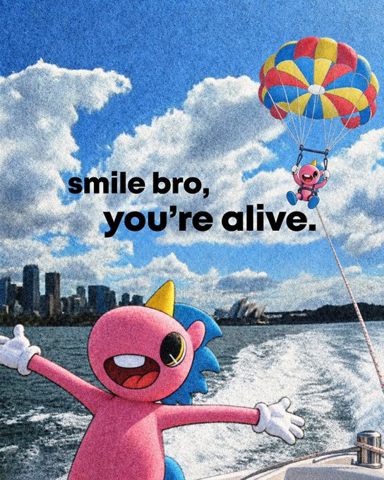 A pink cartoon character parasails through a cloudy sky with the text "smile bro, you're alive." overlaid, with a city skyline visible in the background.