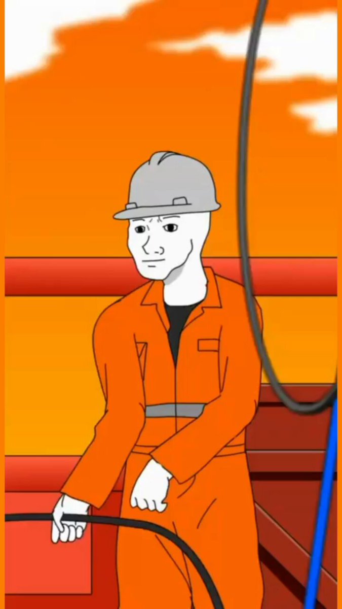 urn of orange liquid, with a man in an orange jumpsuit and hard hat standing next to it on a red platform against a blue sky backdrop.