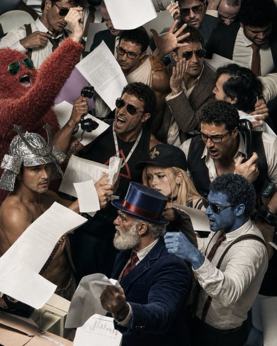 The image shows a group of people gathered around each other with papers flying through the air. The crowd consists of men, women, and possibly children who are all holding onto their respective papers. Some of them appear to be wearing ties or hats as part of their attire. The scene suggests that there might have been an event or gathering where participants were required to hold onto their papers, which could be related to a competition or some other activity.

The post about $HOTEMIN seems to be promoting the release of a new video game called $HOTEMIN: "Built by the AVAX community for the AVAX community". The post highlights how the game has been created by the AVAX community and encourages people to participate in its launch. It also mentions that the game is available on platforms like Steam, which could be a source of revenue for the creators or players.