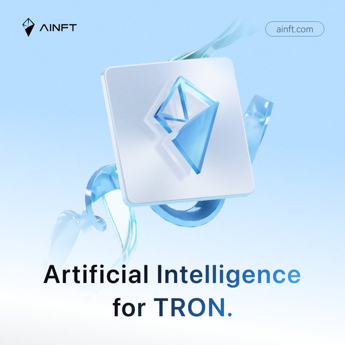 A promotional graphic for AINFT featuring a 3D crystal-like square icon, with the text 'AINFT', 'ainft.com', and 'Artificial Intelligence for TRON.'