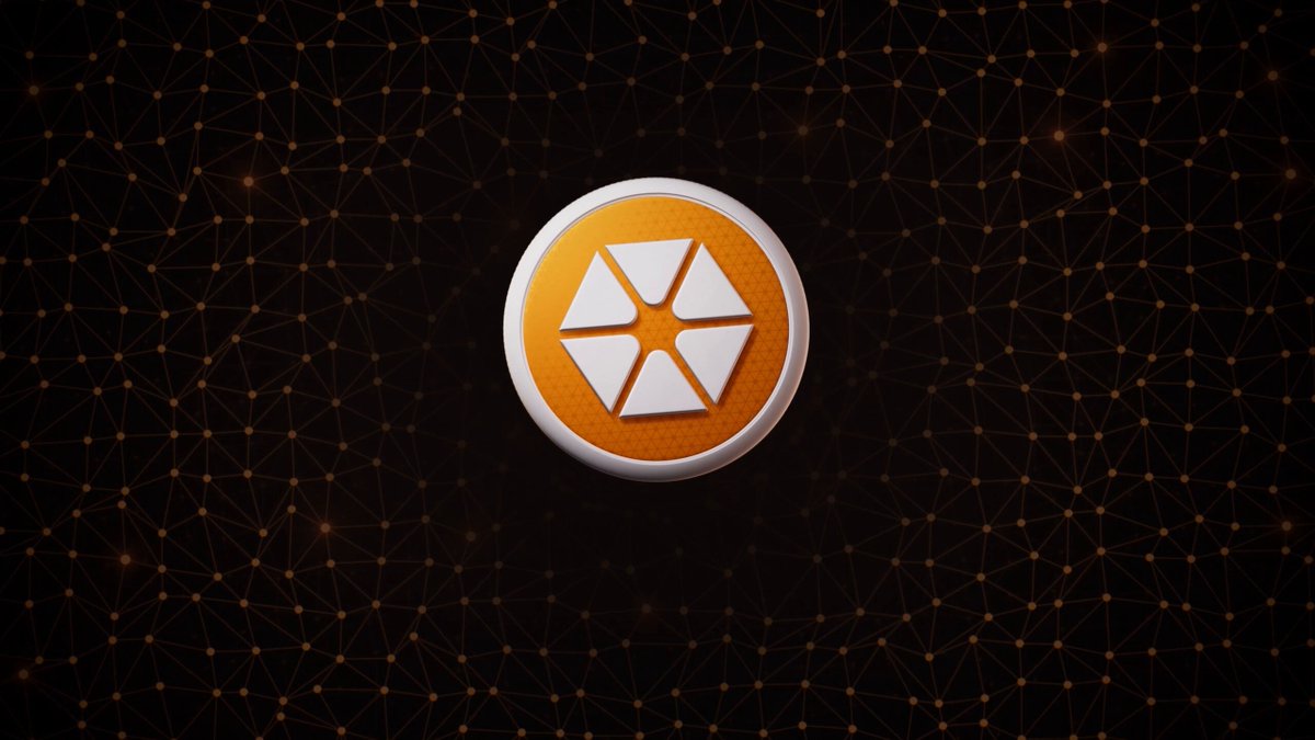 The image features a logo with an orange circle containing a white hexagon, which is the main focus of the photo. The background consists of numerous small dots or lines that create a star-like pattern, giving the impression of a black screen filled with tiny stars. The text "CitreaのCTR、本格始動です ドットコイン経済のための調整資産」としてローンチ" is also present in the image, which could be a description or an explanation of the logo.