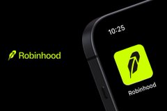 An advertisement showing the Robinhood app icon on a smartphone screen with the Robinhood feather logo and name beside it.