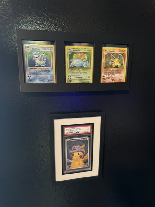 Framed PSA-graded Pokémon cards including Blastoise, Venusaur, Charizard, and a Pikachu illustrator card displayed on a dark wall. The post humorously questions whether completing this set is a better use of $1,000 than alternative investments.