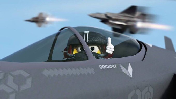The image features a cartoon character giving a thumbs up while sitting inside an airplane cockpit. The character appears to be a pilot or co-pilot, possibly from the popular TV show "Teddie" or another similar series. The airplane is depicted in motion with two other airplanes visible in the background, suggesting that they are either flying together or racing against each other.