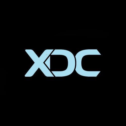 The image shows the XDC Network logo—a stylized light blue "XDC" text on a black background. It visually represents the XDC blockchain network referenced in the post announcing Hex Trust's new role as a Masternode Validator.