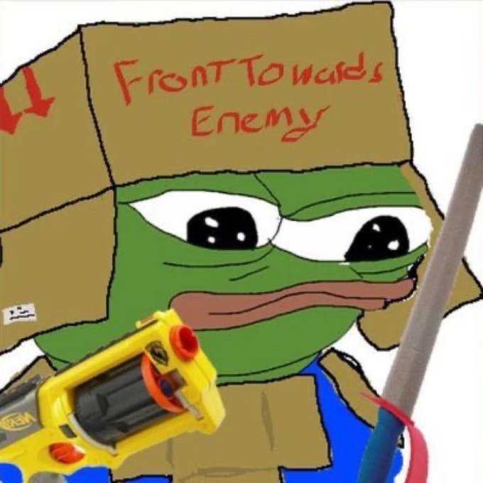 A Pepe the Frog meme character wearing a cardboard box helmet labeled 'FrontTowards Enemy' holds a yellow Nerf blaster.