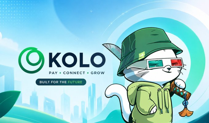 The image features a cartoon cat wearing a green hat, holding a keychain or a small object, standing against a city skyline backdrop with a blue sky above. The caption below the image reads "KOLO PAY + CONNECT + GROW Built for the future". This suggests that the image is related to a post about KOLO and its payment system, possibly discussing how it can be used as an alternative to traditional banking services or highlighting the benefits of using cryptocurrency platforms.