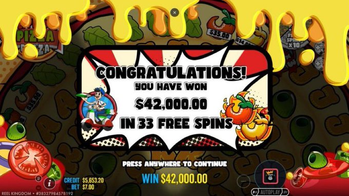 The image is a colorful slot machine win screen displaying "CONGRATULATIONS! YOU HAVE WON $42,000.00 IN 33 FREE SPINS" with cheese, pepper, and tomato graphics, which relates to the accompanying post promoting a gambling offer through a code and ID submission on @bitfortune.