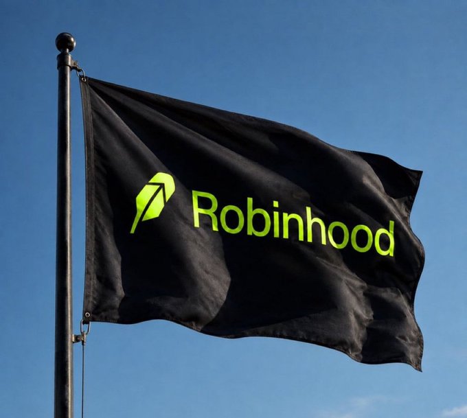 A black flag with the green Robinhood logo and wordmark waving against a clear blue sky.