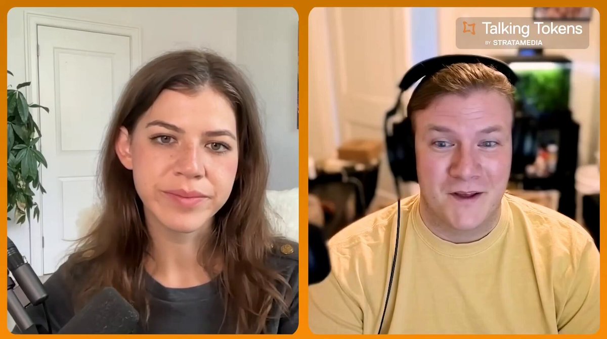 The image shows two people, a man wearing headphones and a woman holding a microphone, having a conversation over a video call. They are both smiling at each other while talking. The background of the image features a white door with an orange frame, which is part of the podcast recording setup.