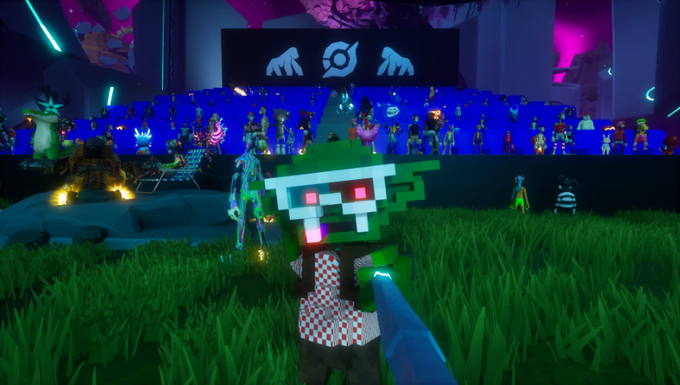 A first-person view in a video game shows a hand reaching toward a blocky green-skinned character with pink glowing eyes in a grassy arena filled with diverse spectators under blue lighting.