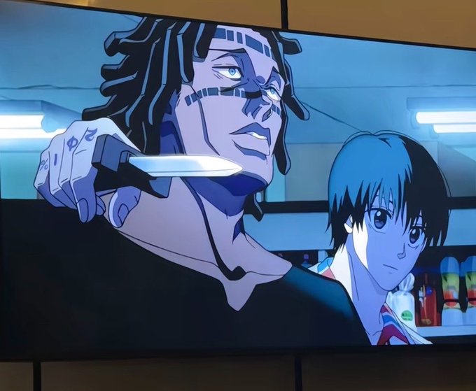 The image shows a TV screen displaying an anime scene featuring a dreadlocked character holding a knife to their own chin, with a young person standing beside them in what appears to be a convenience store. The tense, dramatic anime imagery contrasts with the casual "gm frens of xay" greeting, likely shared as a humorous "good morning" post with an unexpectedly intense anime visual.